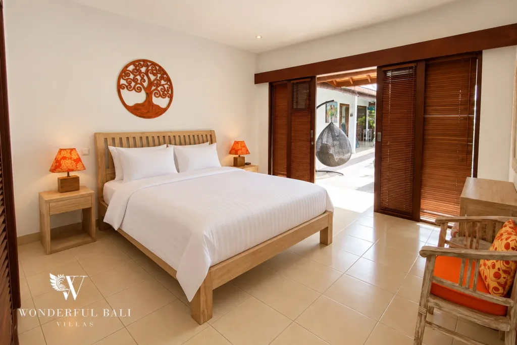 3BR villa for rent in Padonan, Canggu — bedroom, bedroom with louvred doors opening onto the pool terrace