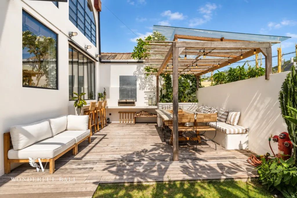 3BR villa for sale in Berawa — terrace, timber-decked terrace with a lounge sofa and pergola
