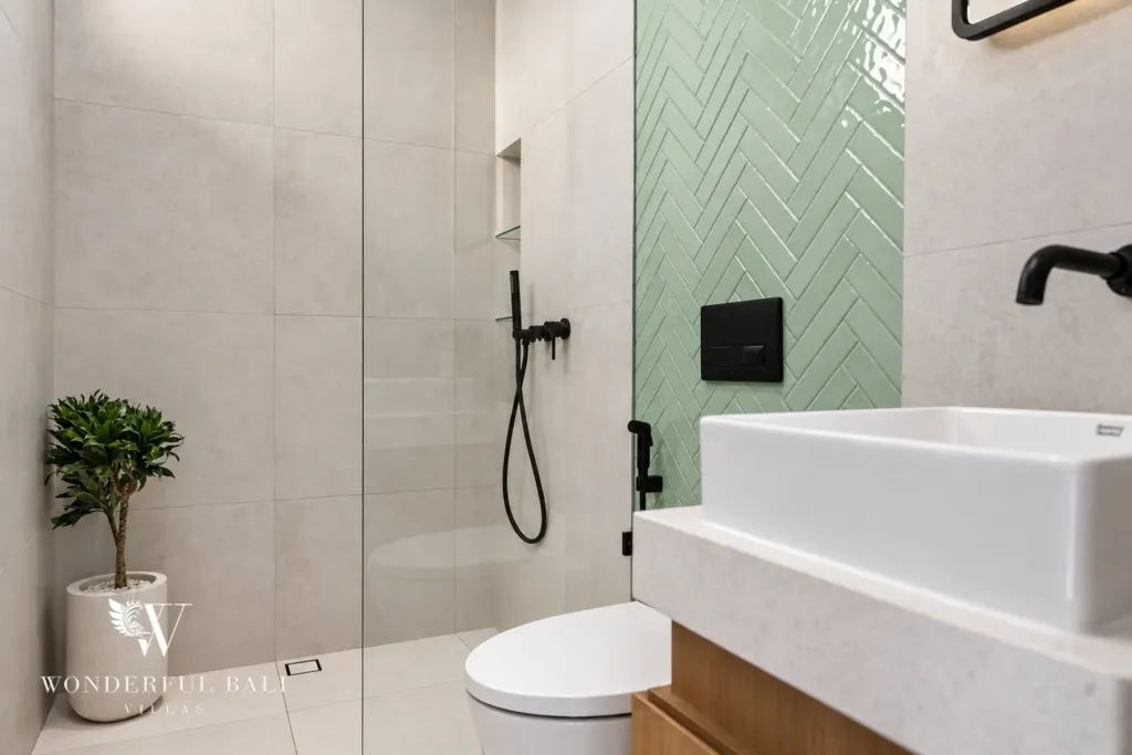 2BR villa for rent in Padonan, Canggu — bathroom, walk-in shower with sage herringbone tiles