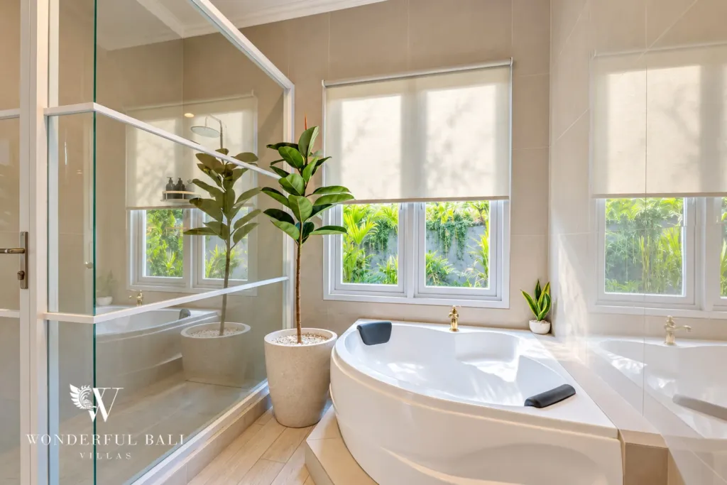 5BR villa for sale in Pererenan — corner bathtub beside garden windows