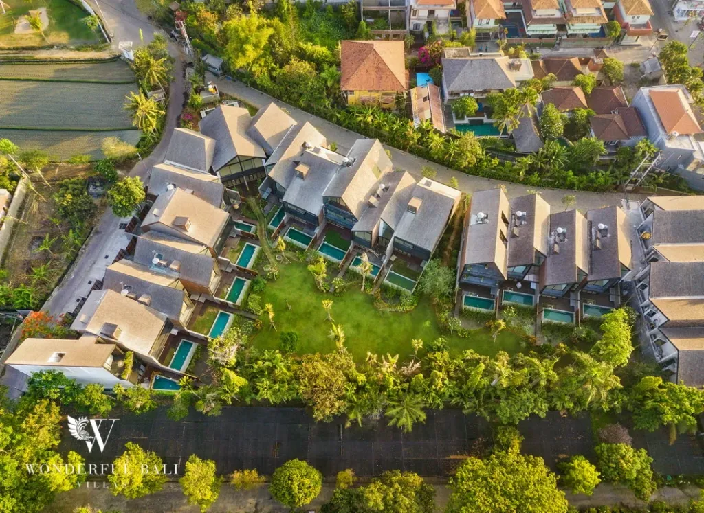 4BR villa for rent in Berawa, Canggu — exterior, the estate and its surrounding green belt from the air