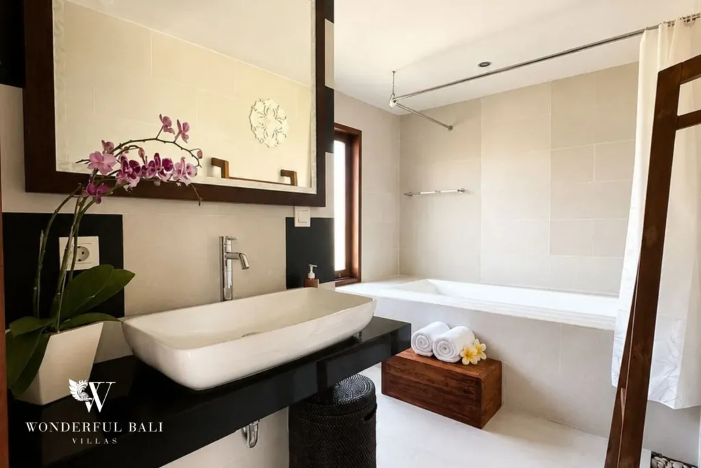 4BR villa for rent in Padonan, Canggu — bathroom 2, vessel basin on a dark counter beside the bathtub
