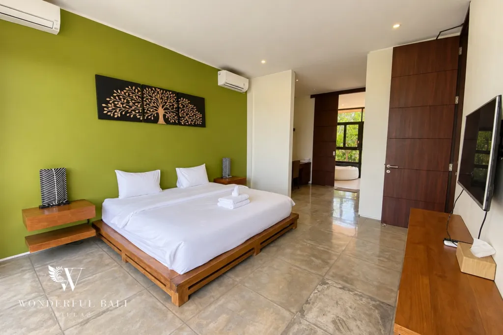 3BR villa for sale in Jimbaran — bedroom, bedroom with a carved tree panel above the bed