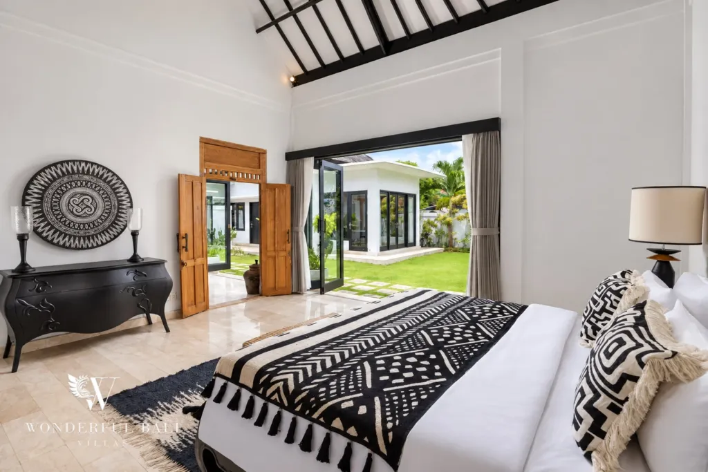 4BR villa for rent in Batu Bolong, Canggu — bedroom, bedroom doors opening to the garden path and lawn