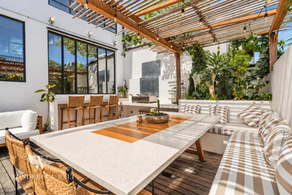 3BR villa for sale in Berawa — terrace, outdoor dining table with striped bench seating
