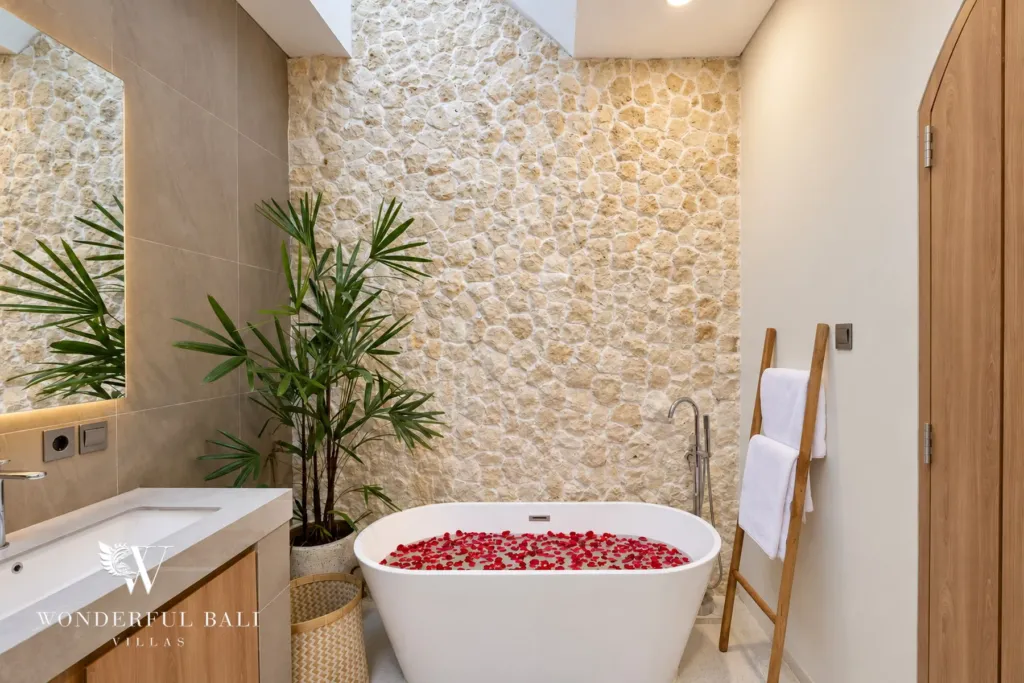3BR villa for rent in Berawa, Canggu — bathroom, freestanding tub against a pale stone wall
