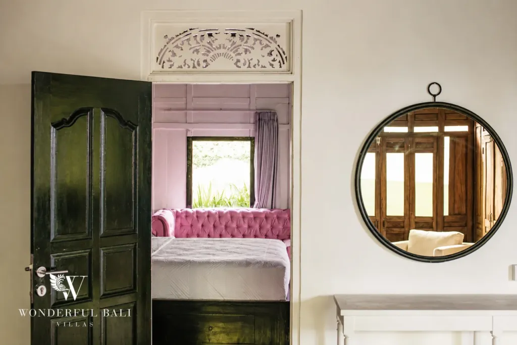 3BR villa for rent in Berawa, Canggu — bedroom 3, bedroom seen through the carved doorway