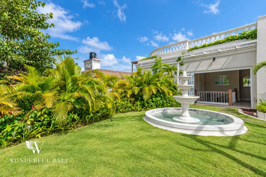 5BR villa for sale in Pererenan — landscaped garden with fountain below the rooftop terrace