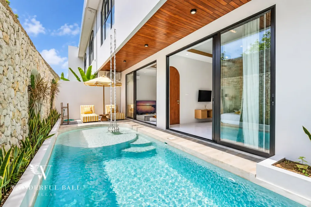 3BR villa for rent in Umalas, Bali — pool, pool running alongside the timber-ceilinged terrace and living room