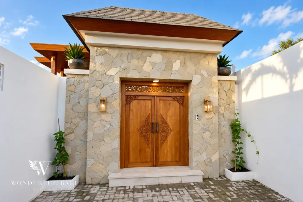4BR villa for rent in Cemagi — entrance, stone gatehouse with carved teak doors