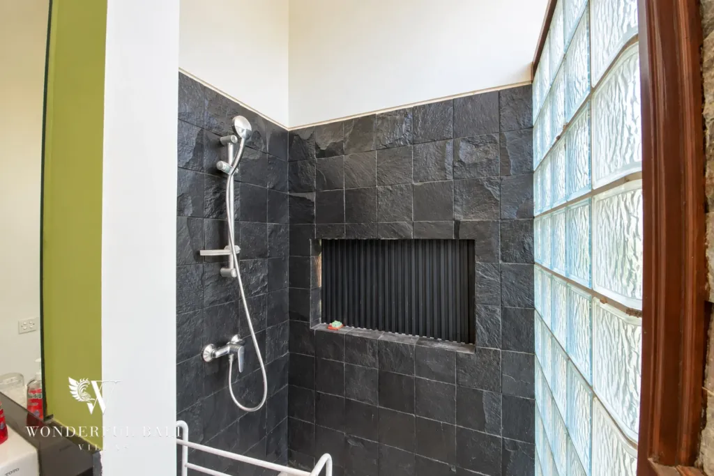 3BR villa for sale in Jimbaran — bathroom, walk-in shower with slate tiles and a glass-block wall