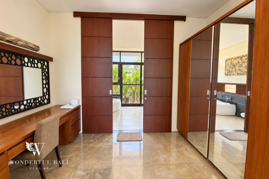 3BR villa for sale in Jimbaran — bedroom, dressing table and wardrobes leading to the ensuite