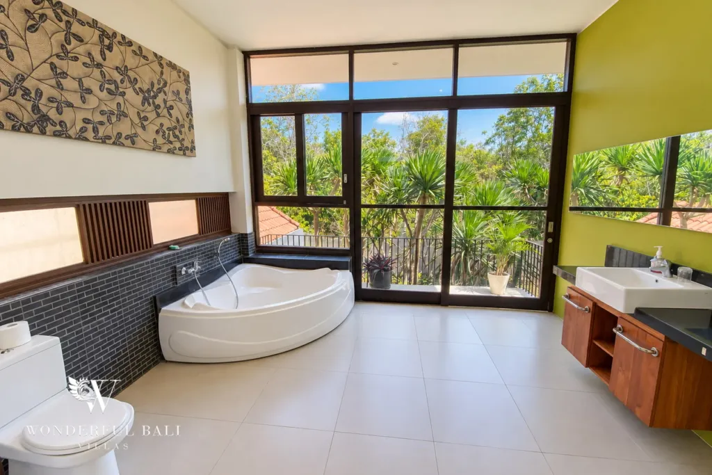 3BR villa for sale in Jimbaran — bathroom, ensuite with a corner bathtub and garden windows