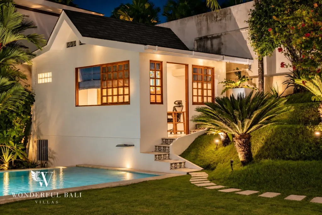 5BR villa for rent in Bumbak, Umalas — guest pavilion, the separate guest pavilion beside the pool lit at night