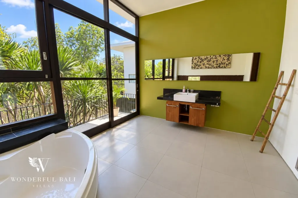 3BR villa for sale in Jimbaran — bathroom, ensuite with a freestanding tub and full-height windows