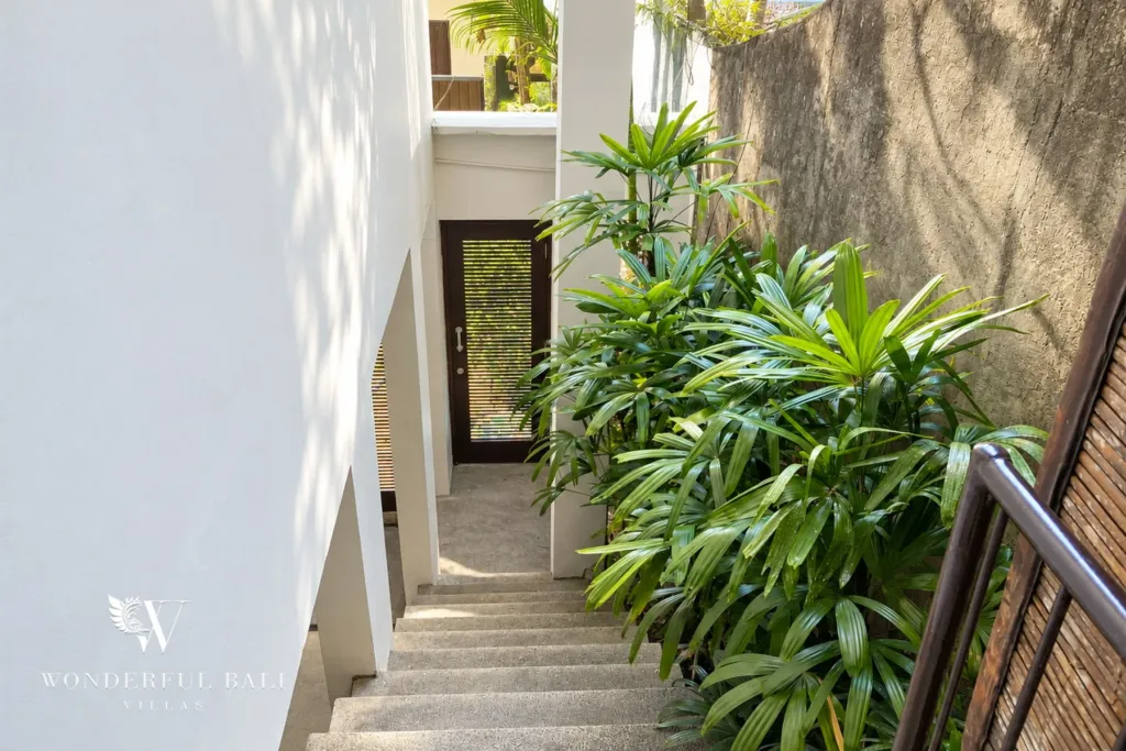 3BR villa for sale in Jimbaran — garden, side stairway through tropical planting