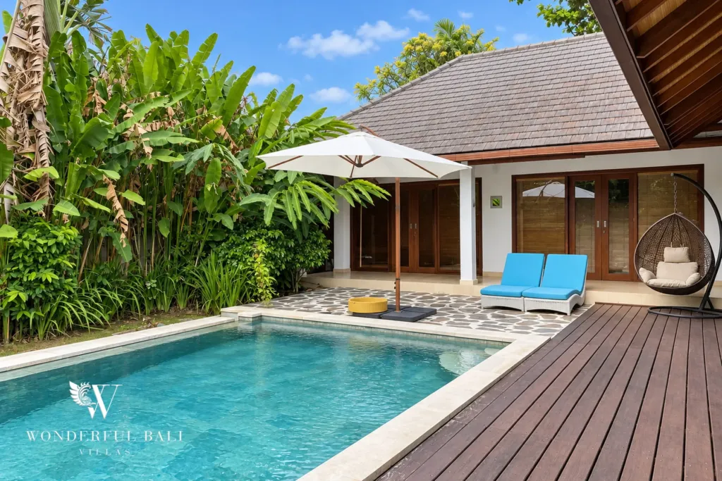 3BR villa for rent in Padonan, Canggu — pool, timber deck running the length of the pool towards the garden