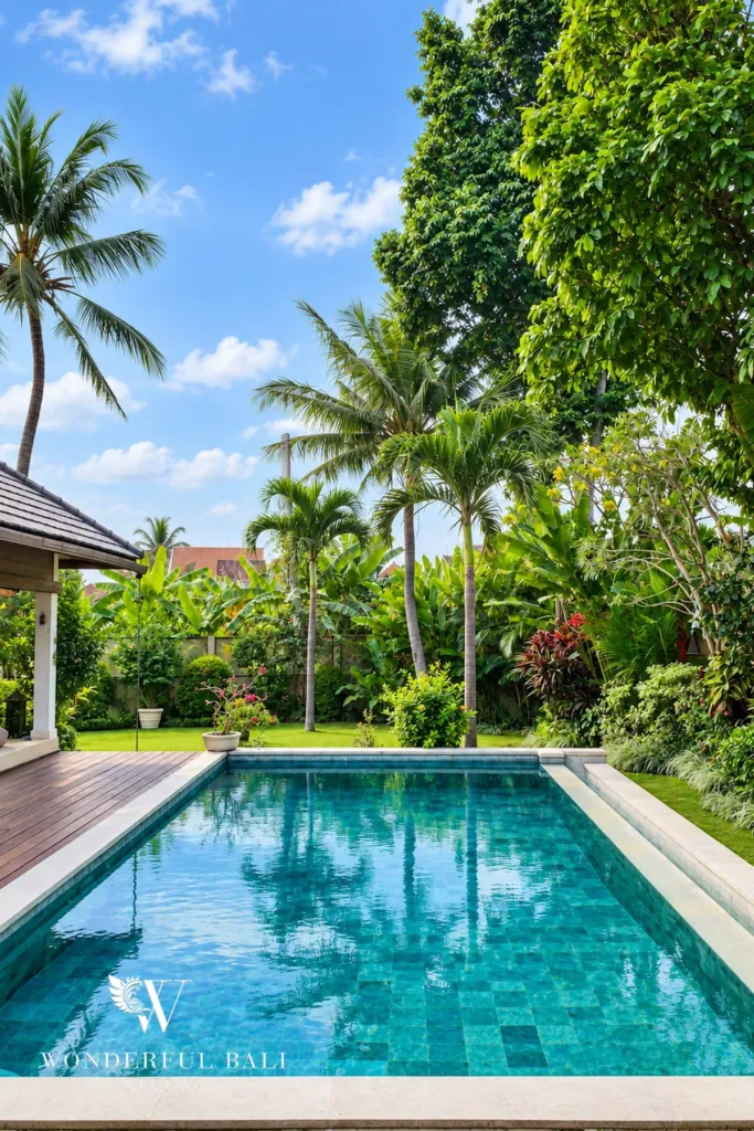 3BR villa for rent in Padonan, Canggu — pool, the pool framed by palms and dense tropical planting