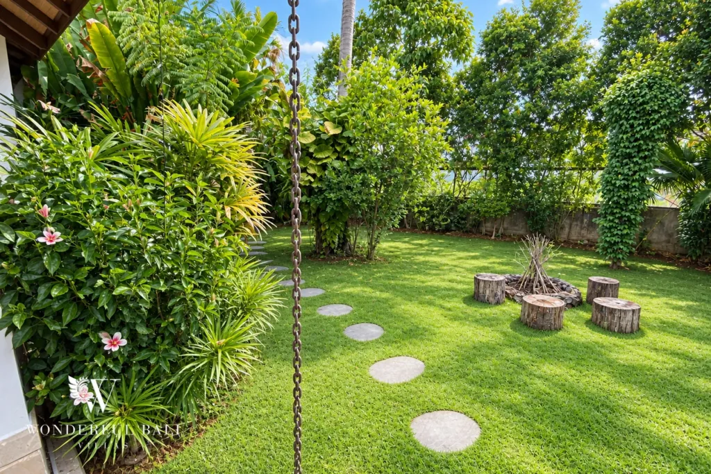 3BR villa for rent in Padonan, Canggu — garden, stone stepping stones through pebbles beside a planted wall