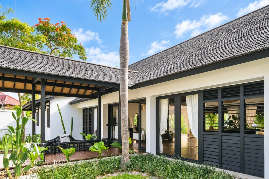 5BR villa for rent in Munggu, Bali — exterior, planted courtyard between the white pavilions with cacti