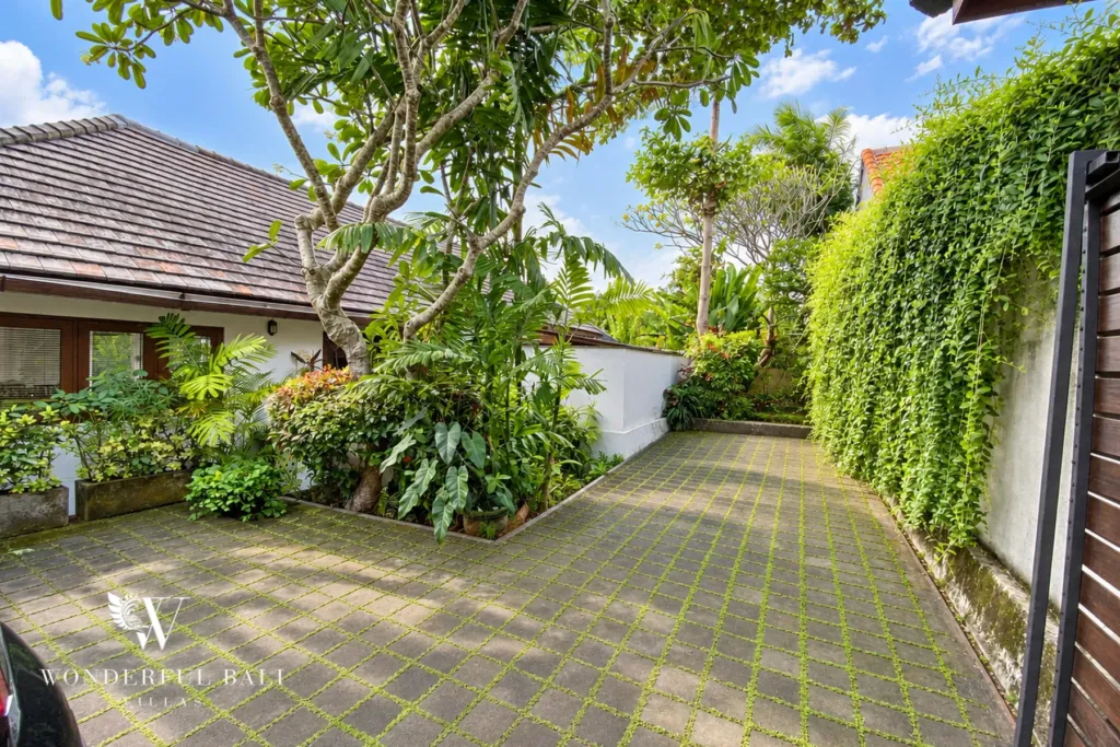 3BR villa for rent in Padonan, Canggu — parking, paved driveway leading in past planted borders to the villa