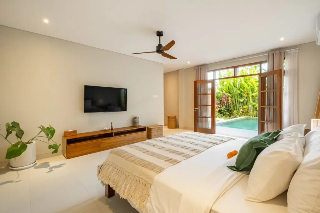 Ground-floor bedroom opening onto the pool at Villa Reviva
