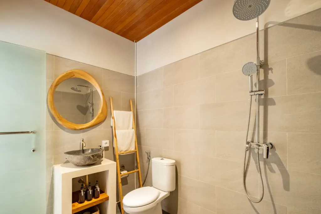 En-suite with a rain shower and stone vessel basin at Villa Reviva