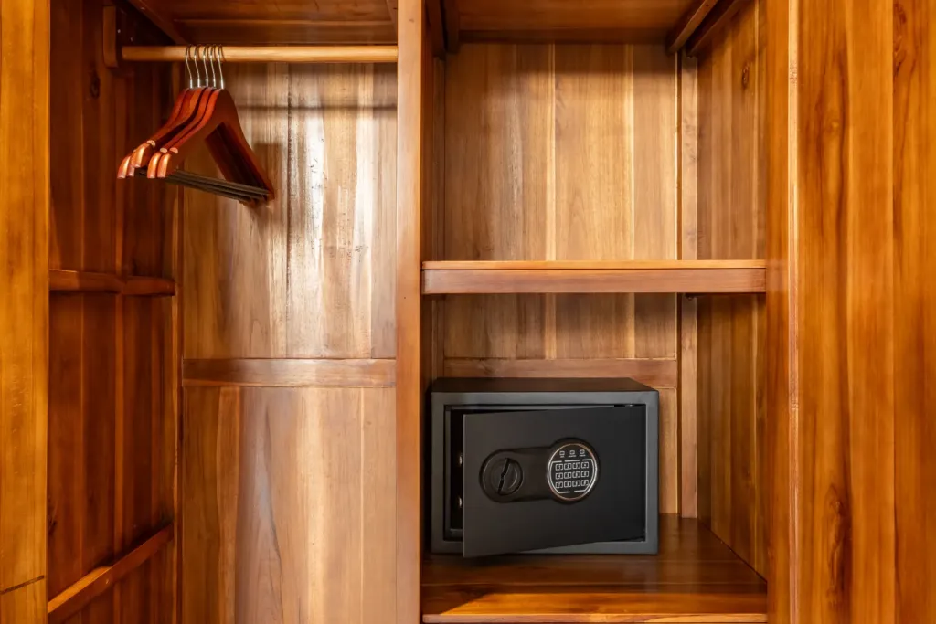 Timber wardrobe with a safe, fitted in each bedroom at Villa Reviva