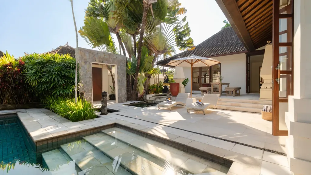 Pool terrace, lotus pond and tropical garden at Villa V Seminyak