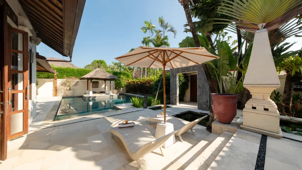 The pool terrace seen from a pavilion doorway at Villa V Seminyak