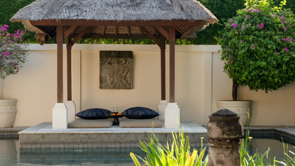 Bale with cushions set over the water at Villa V Seminyak