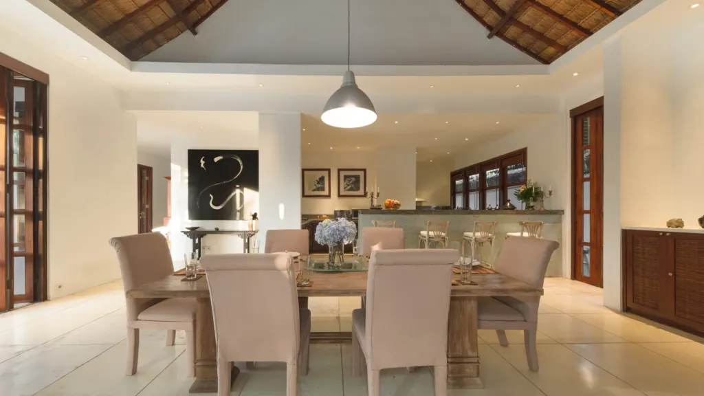 Dining table for eight under the thatched roof at Villa V Seminyak