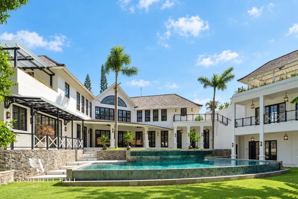 7BR villa for sale in Umalas — colonial-style estate with infinity pool and tropical riverfront garden
