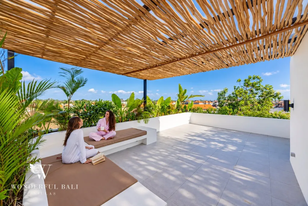 2BR villa for rent in Munggu — rooftop terrace with a shaded daybed and open views