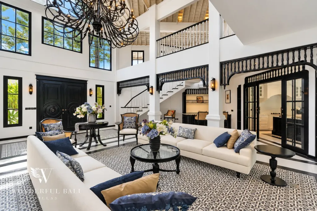 7BR villa for sale in Umalas — double-height living room with chandelier and black timber fretwork