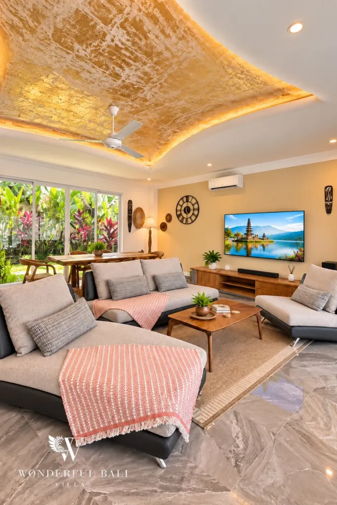 3BR villa for rent in Padonan — living room with sofas and TV opening to the garden