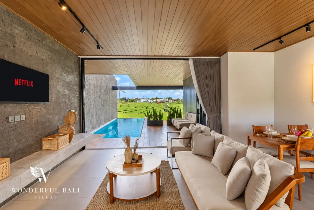 3BR villa long term rental Canggu — living room opening onto the infinity pool