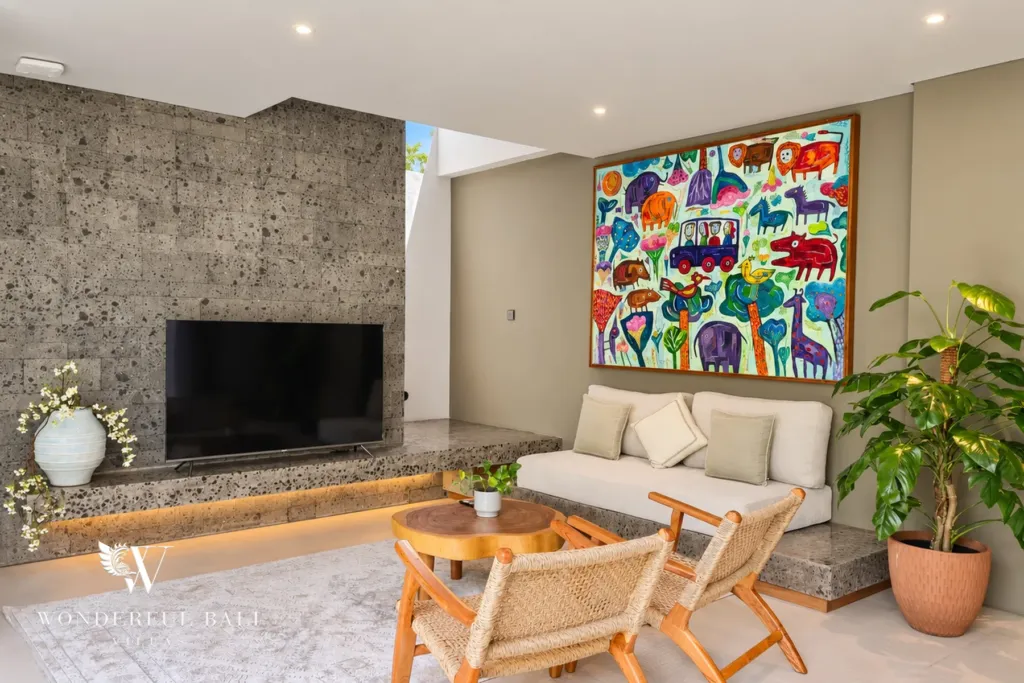 2BR villa long term rental Pererenan — living room with Smart TV and stone feature wall