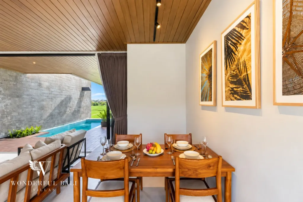 3BR villa long term rental Canggu — dining table beside the pool doors