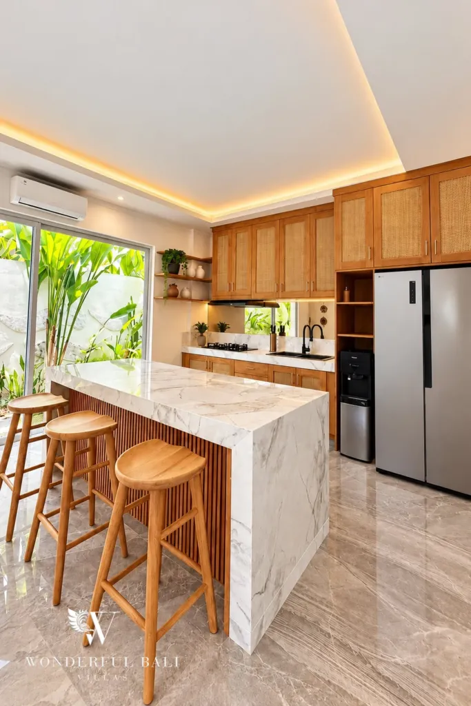3BR villa for rent in Padonan — kitchen with marble island, bar stools and double fridge