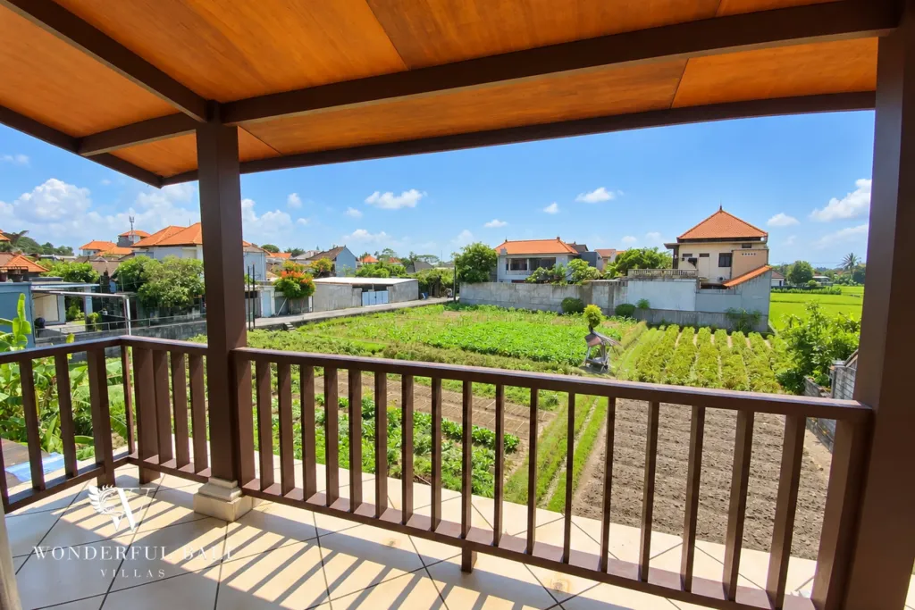3BR villa for rent in Sanur — covered balcony looking over green fields