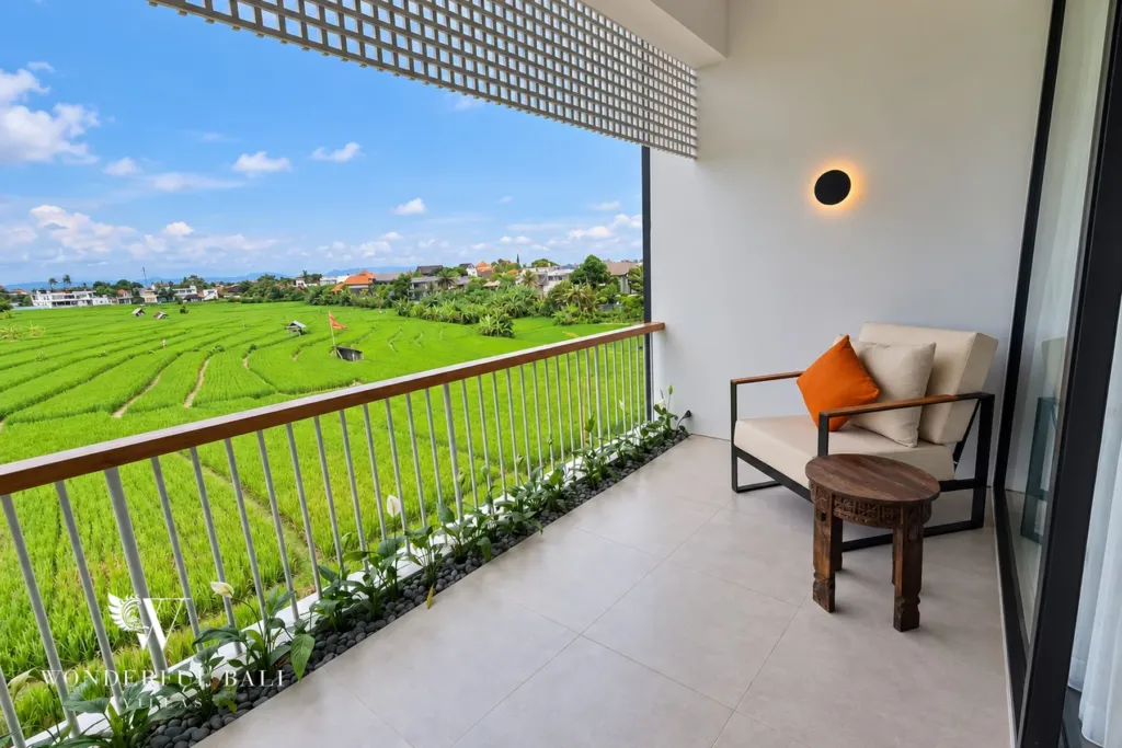 3BR villa long term rental Canggu — balcony armchair overlooking the rice fields
