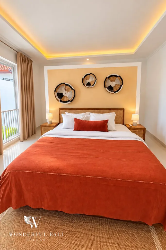 3BR villa for rent in Padonan — bedroom with double bed and woven wall decor
