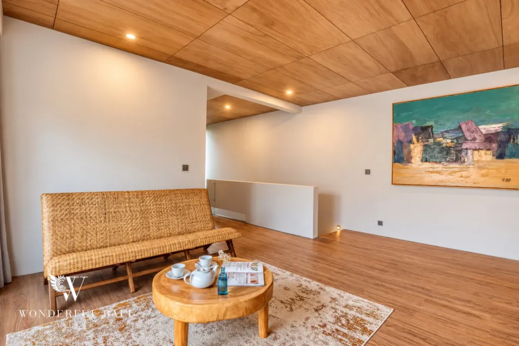2BR villa long term rental Pererenan — upstairs lounge under a timber ceiling