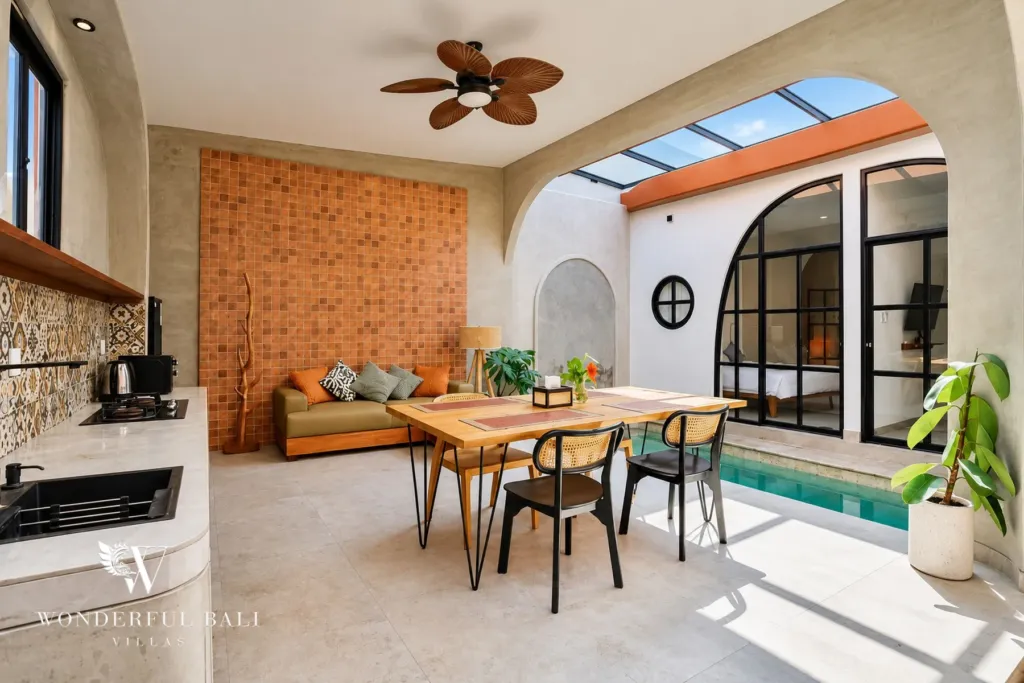 2BR villa for sale in Sanur — dining area and kitchen opening onto the pool