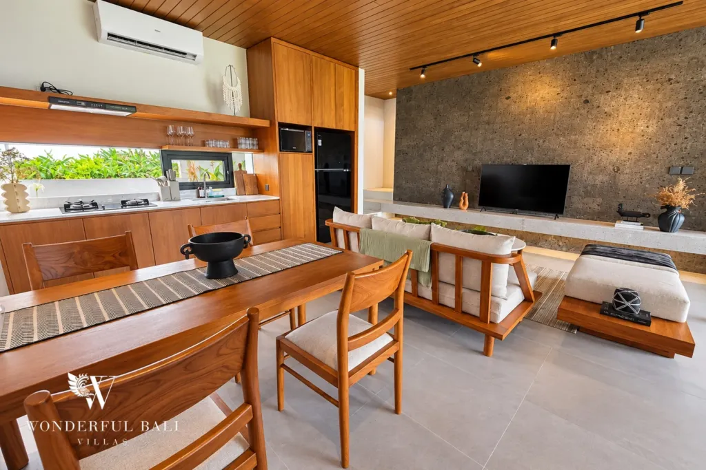 3BR villa long term rental Canggu — teak dining table and fully equipped kitchen