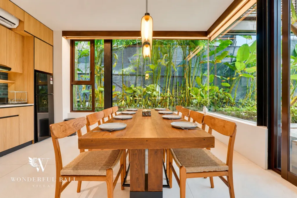 4BR villa for sale in Canggu — dining table beside a garden window