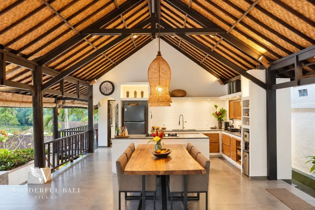 3BR villa for rent in Tabanan — timber dining table in front of the white kitchen