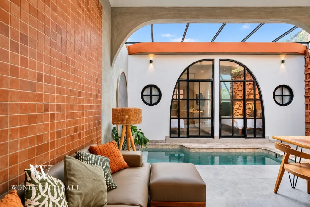 2BR villa for sale in Sanur — lounge sofa beside the private pool