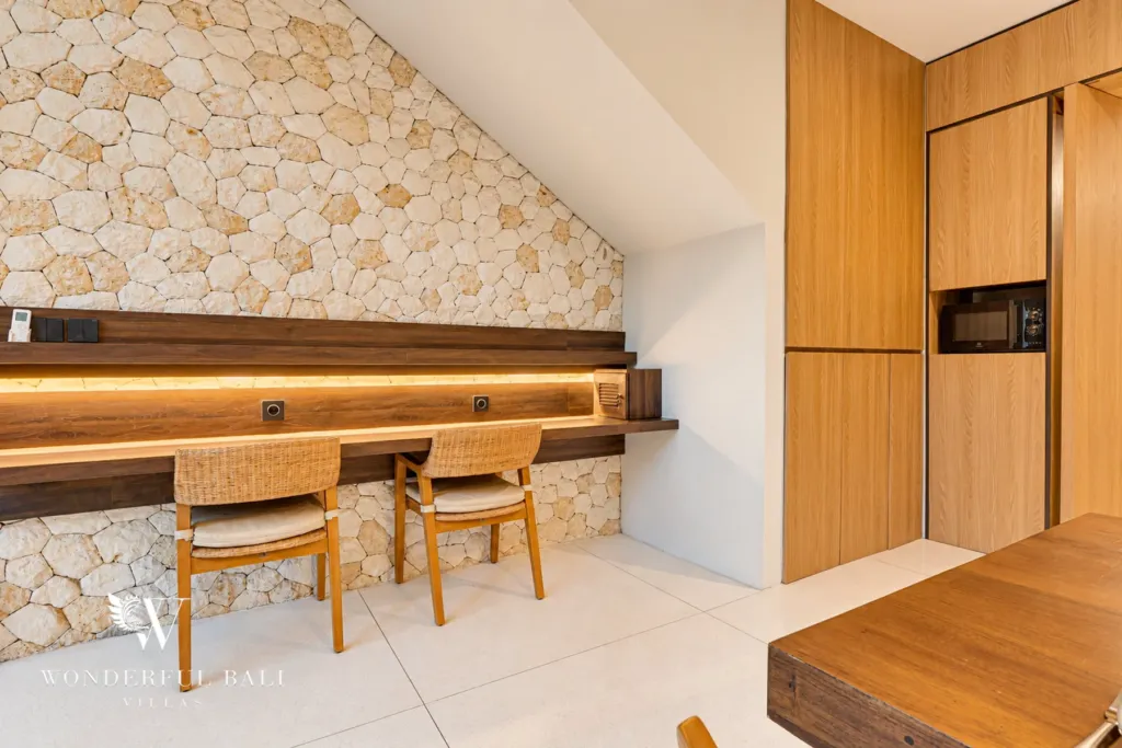 4BR villa for sale in Canggu — built-in desk for two against a stone wall